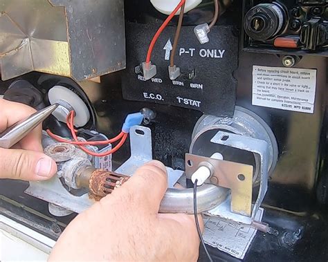 If you need to adjust the flame, simply loosen the nut on the pipe and slide the pipe one direction or the other. . Rv hot water heater not igniting